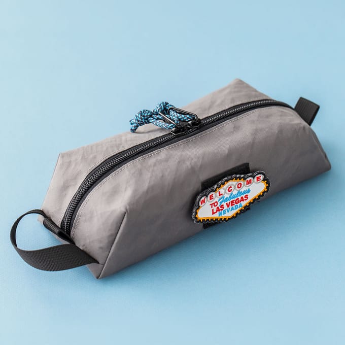 Closed pouch angle 1: Livingston slim EDC box pouch sewing pattern in grey fabric, angled view