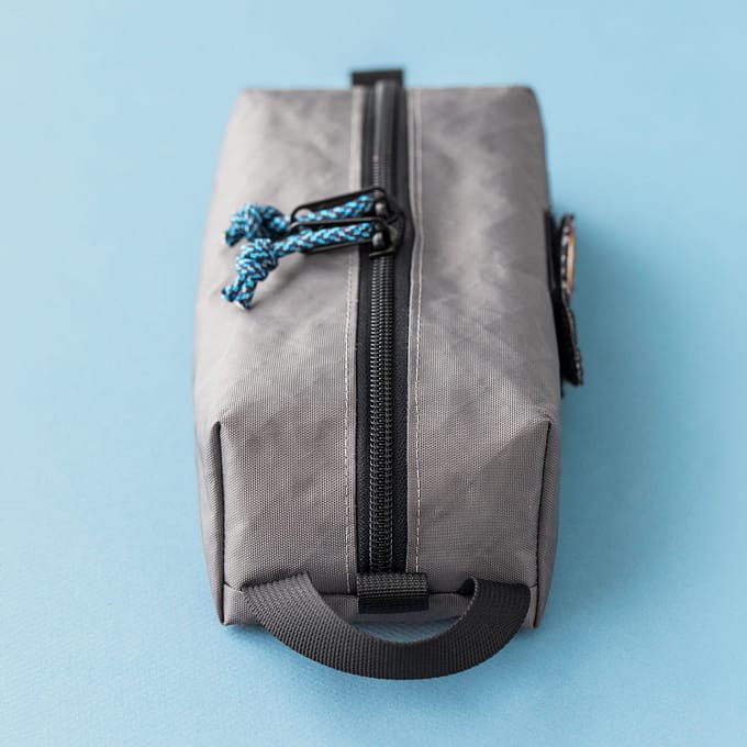 Closed pouch angle 4: Livingston slim EDC box pouch sewing pattern in grey fabric, side view